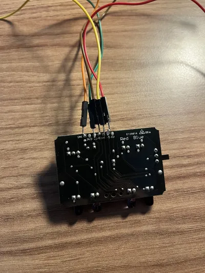 Wires soldered onto the original PCB during the first motor-control attempt.